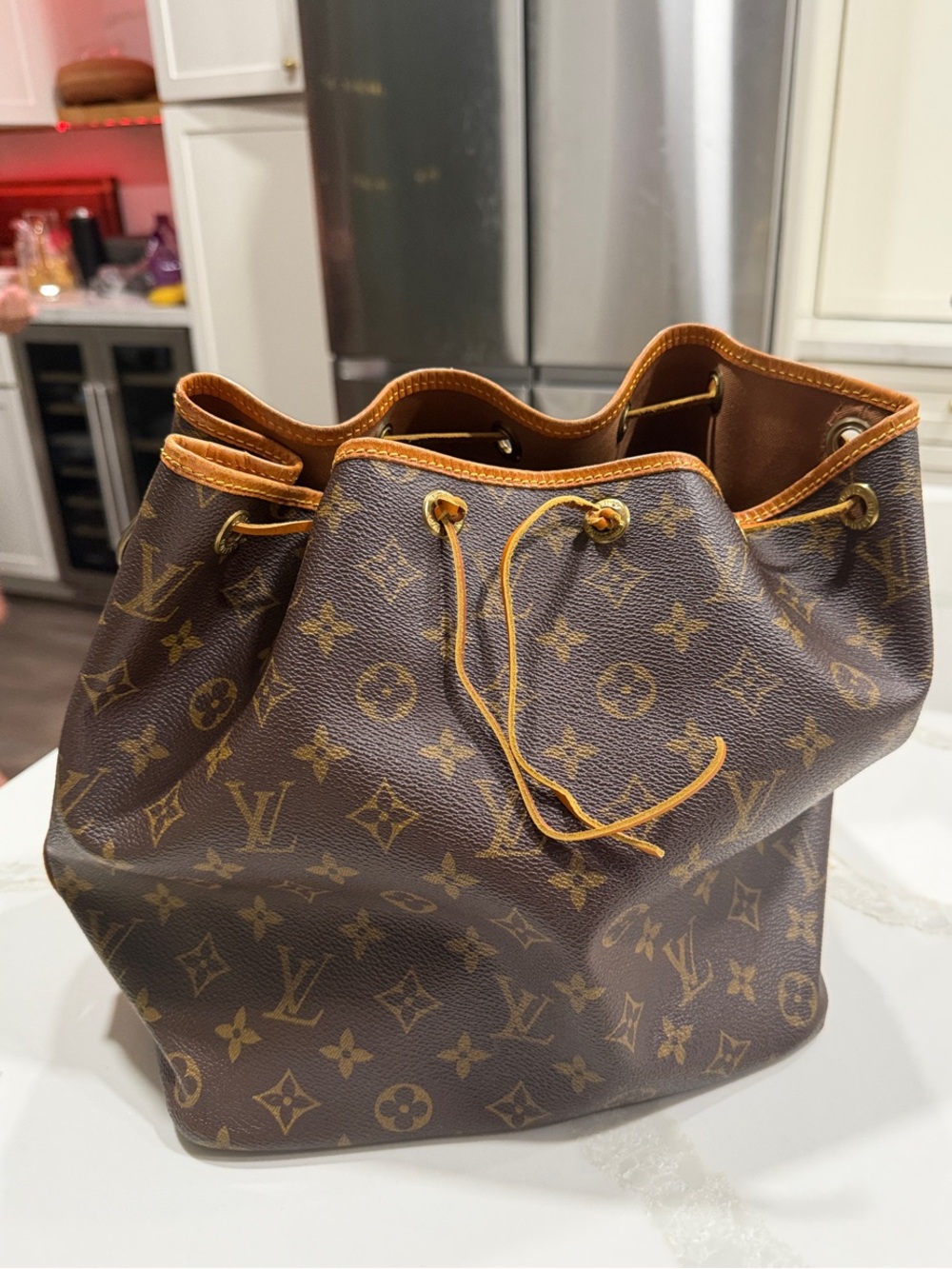 Authentic Louis Vuitton Monogram Canvas Drawstring Bucket Bag in Brown and Tan